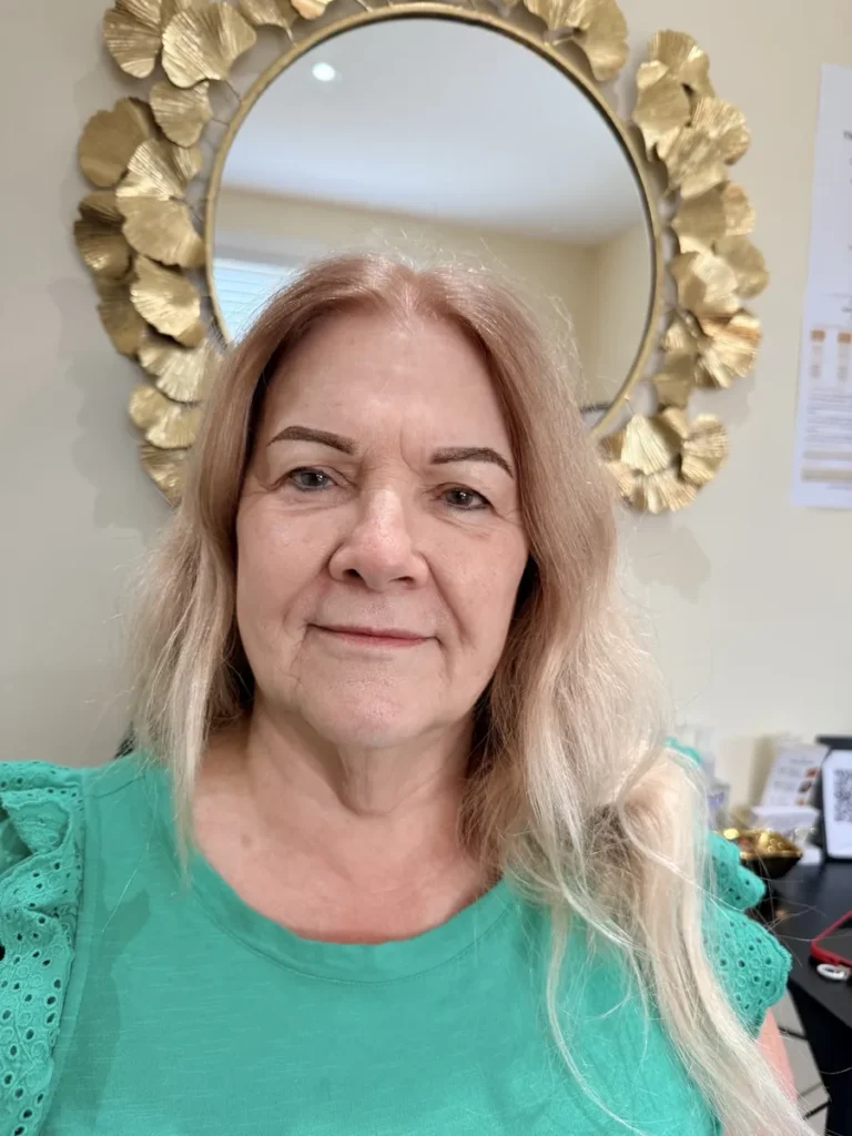 Client with a gentle smile showing soft brown Nano Brows at Vivi Brows & Head Spa in London, Ontario