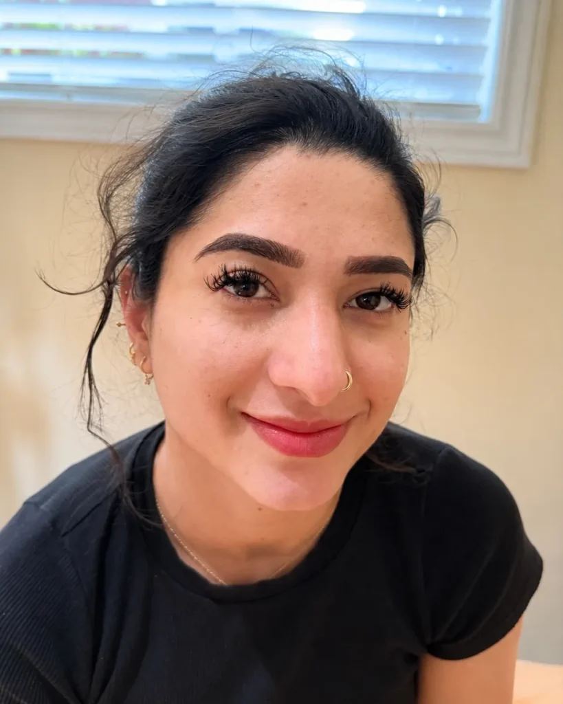 Smiling client with full, dark Nano Brows at Vivi Brows & Head Spa in London, Ontario
