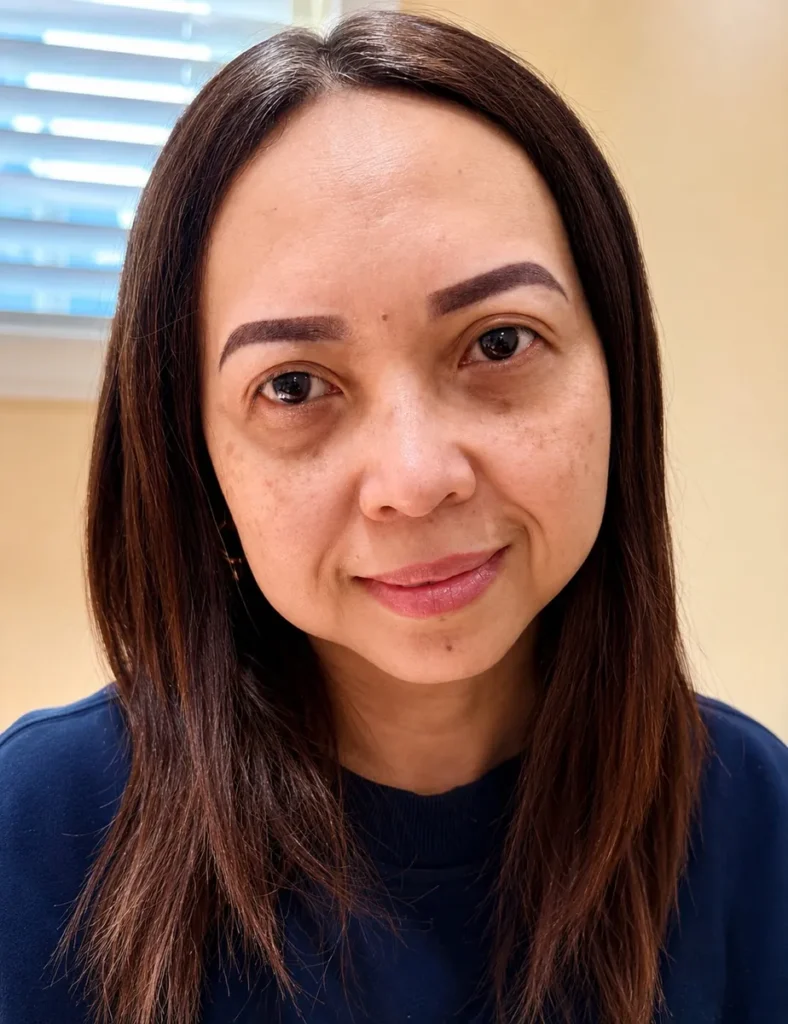 Client with dark, defined Nano Brows with a soft front at Vivi Brows & Head Spa in London, Ontario
